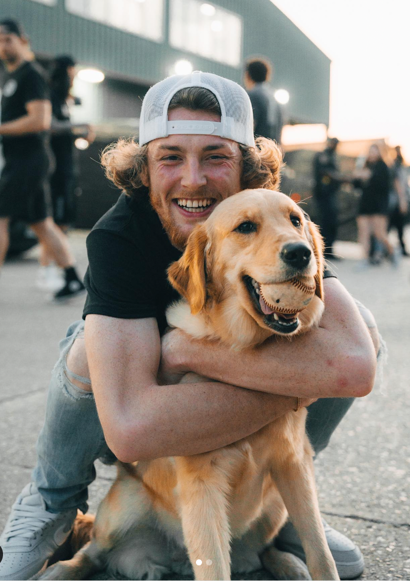 Man Hugging Golden Retriever Wallpaper