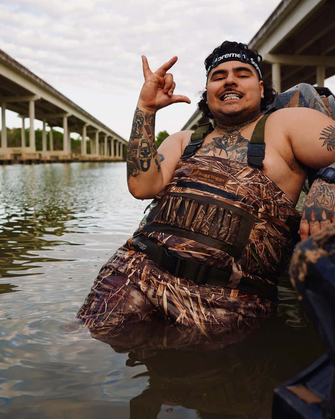 Man Making Peace Sign In Water.jpg Wallpaper