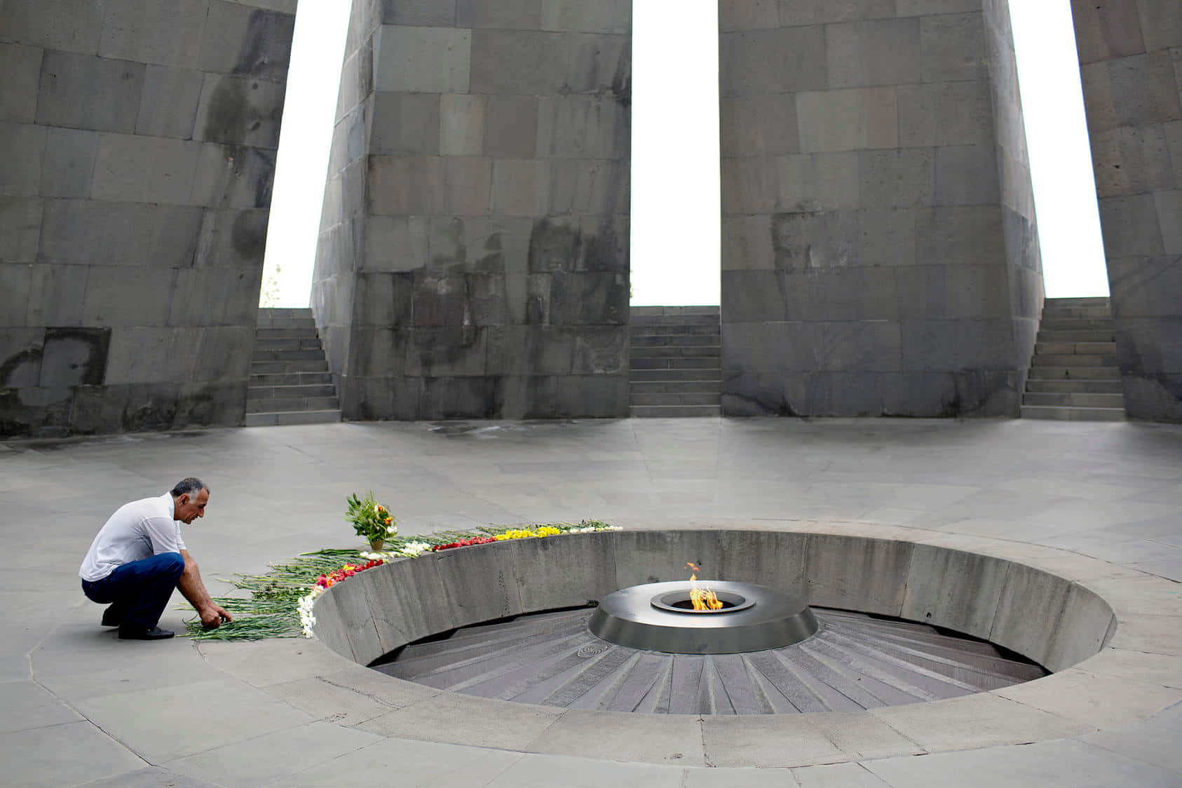 Man Offering Flowers Armenian Genocide Memorial Wallpaper