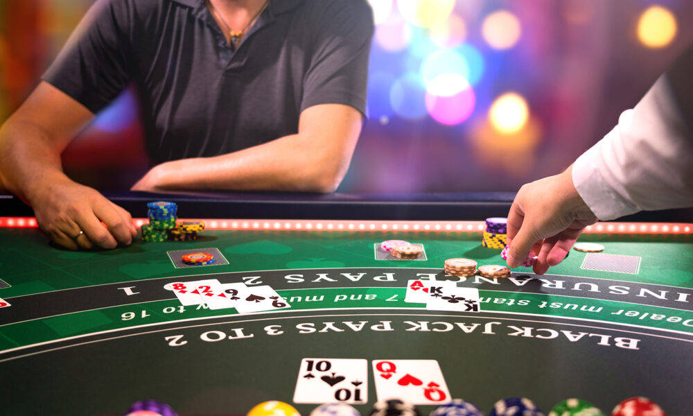 Man Playing Blackjack With Dealer Wallpaper