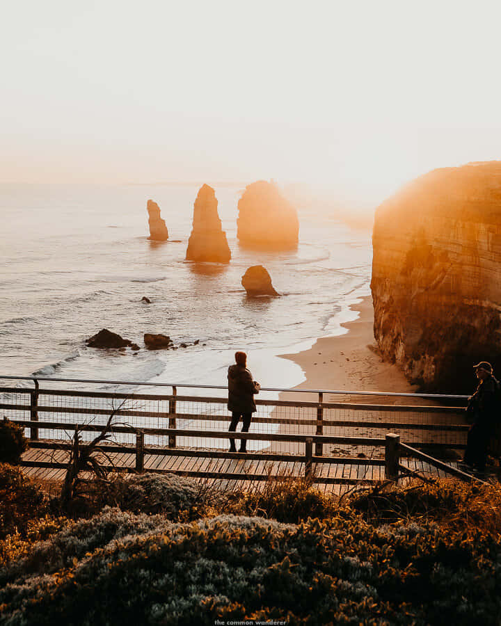 Man Silhouette In Twelve Apostles In Victoria Australia Wallpaper