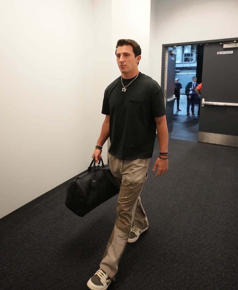 Man Walking Through Corridor Wallpaper