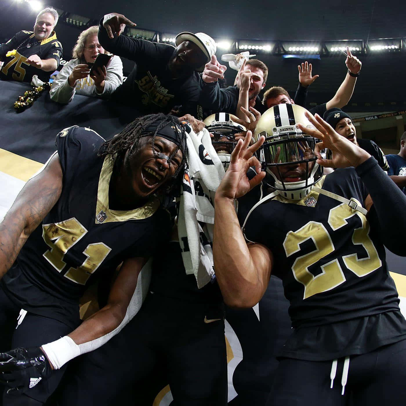 Marshon Lattimore Celebrating With His Teammates Wallpaper