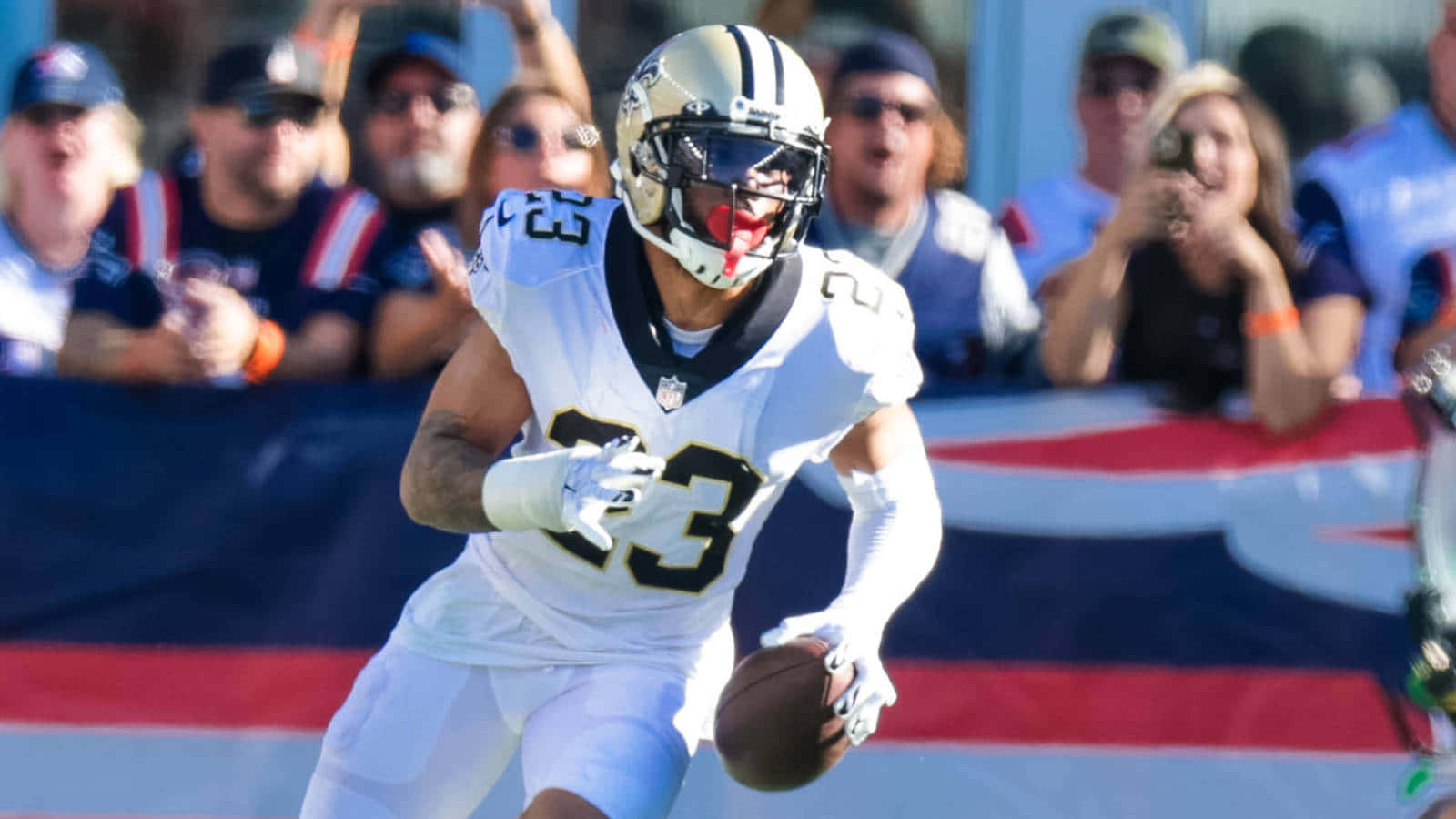 Marshon Lattimore Holding The Ball Wallpaper