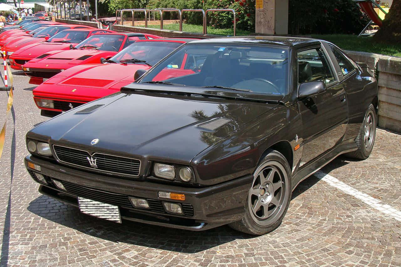 Maserati Shamal Parked Amongst Ferraris Wallpaper