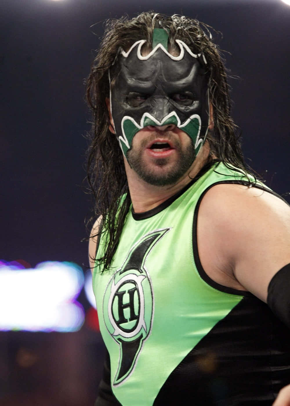 Masked Wrestlerin Green Attire Wallpaper