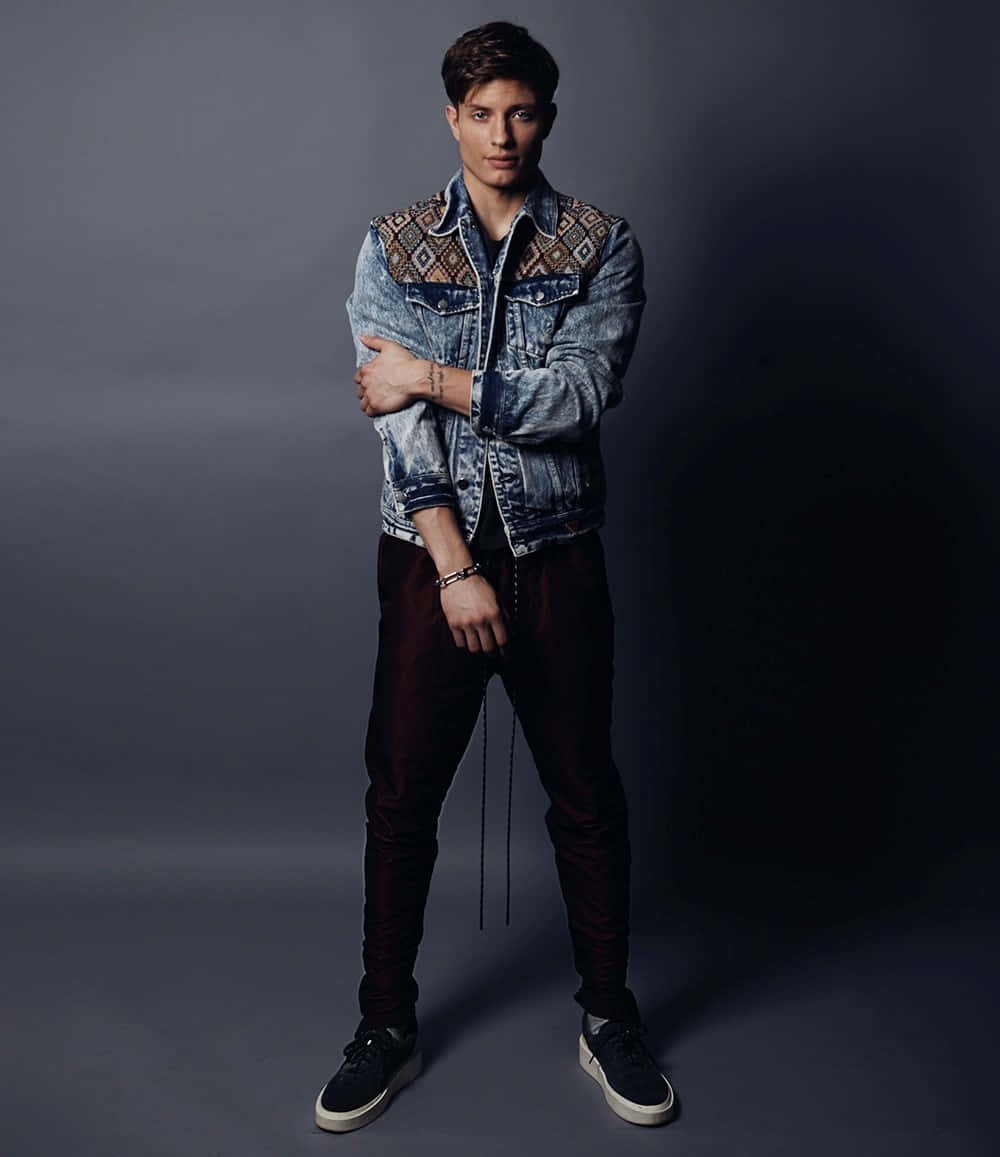 Matt Rife Striking A Pose During A Photoshoot. Wallpaper