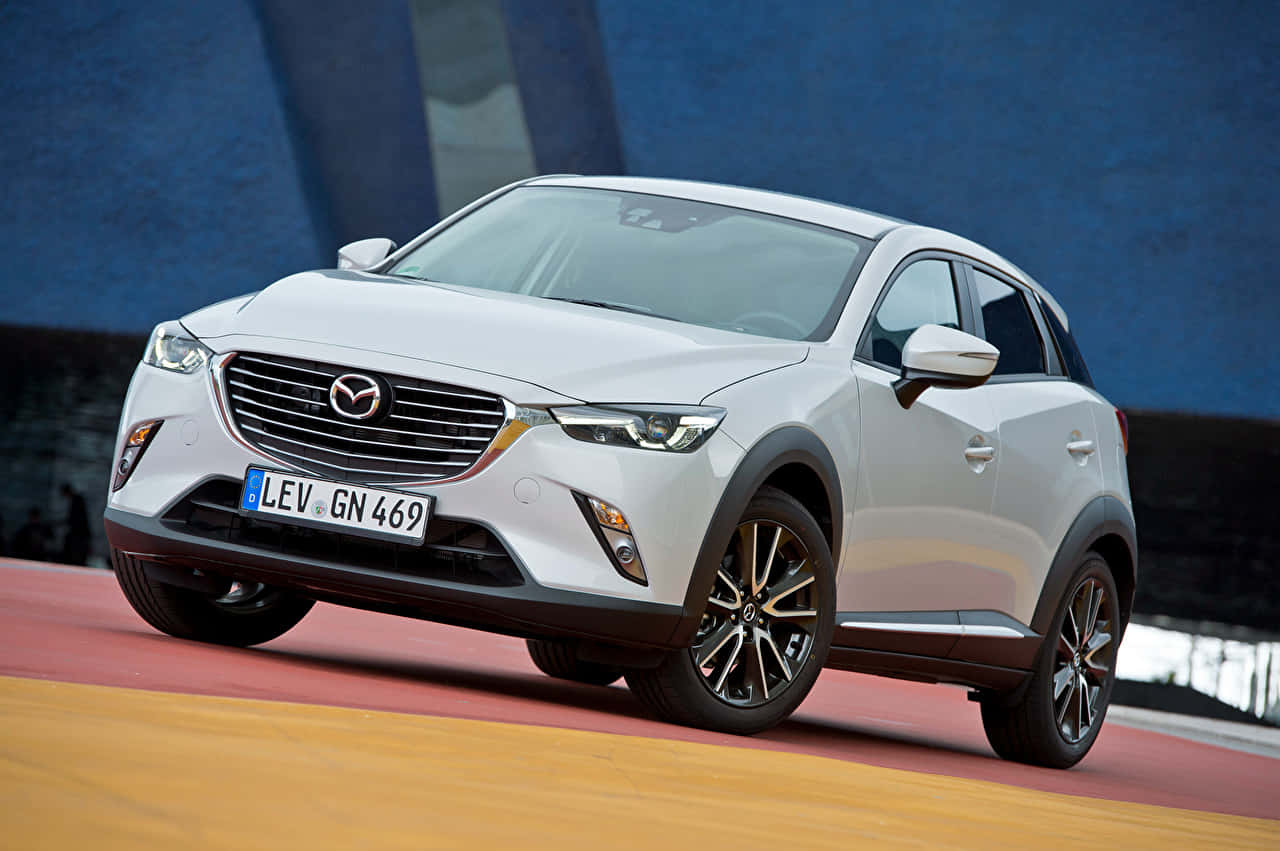 Mazda C X3 White S U V Driving Dynamic Wallpaper