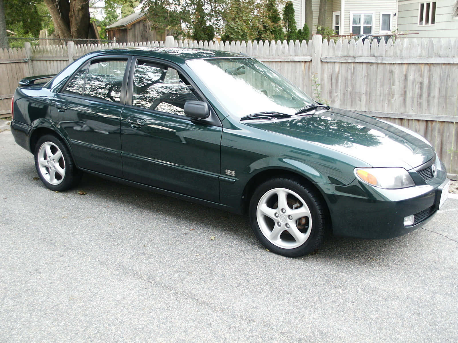 Mazda Protege In Vibrant Red Wallpaper