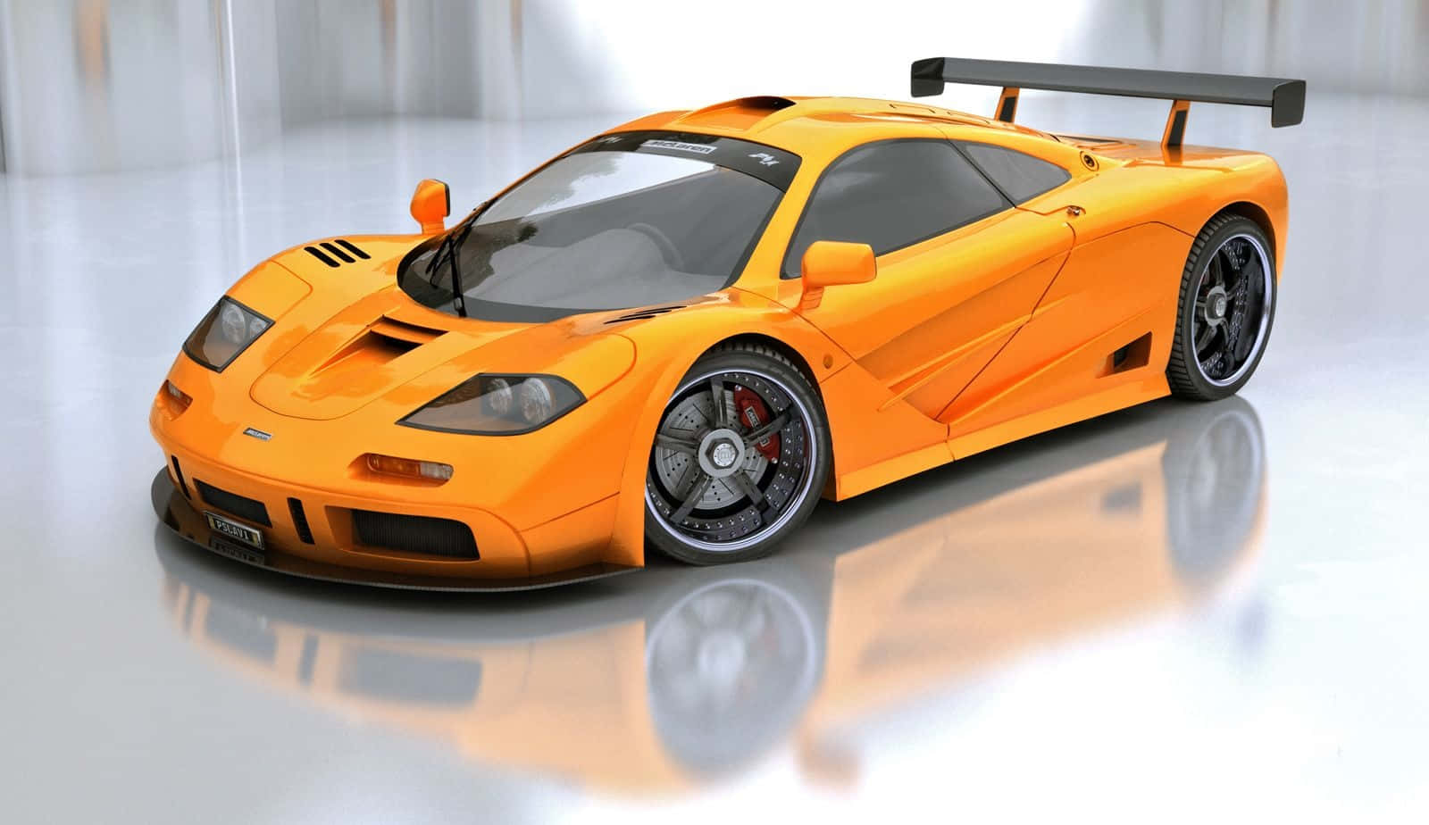 Mclaren F1 Racing On The Track Wallpaper