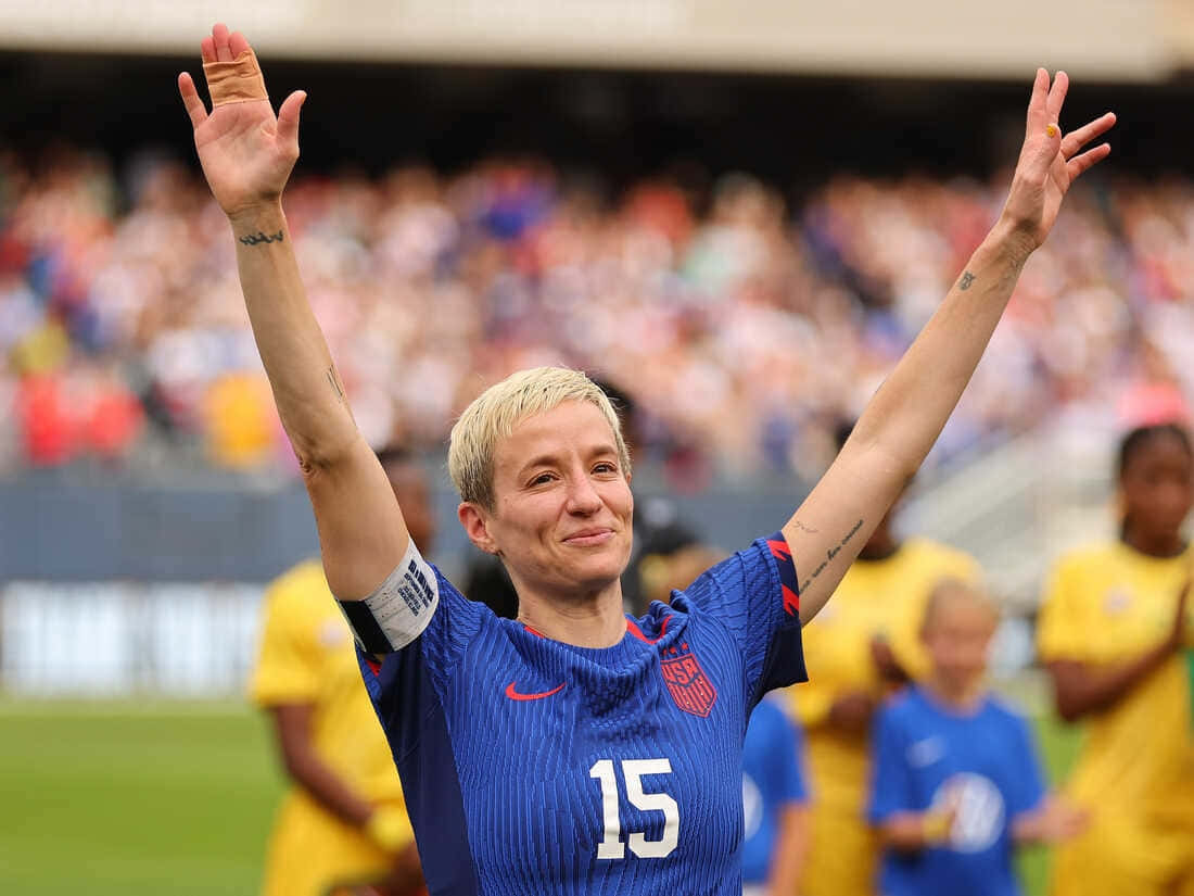 Megan Rapinoe Celebrating Victory Wallpaper