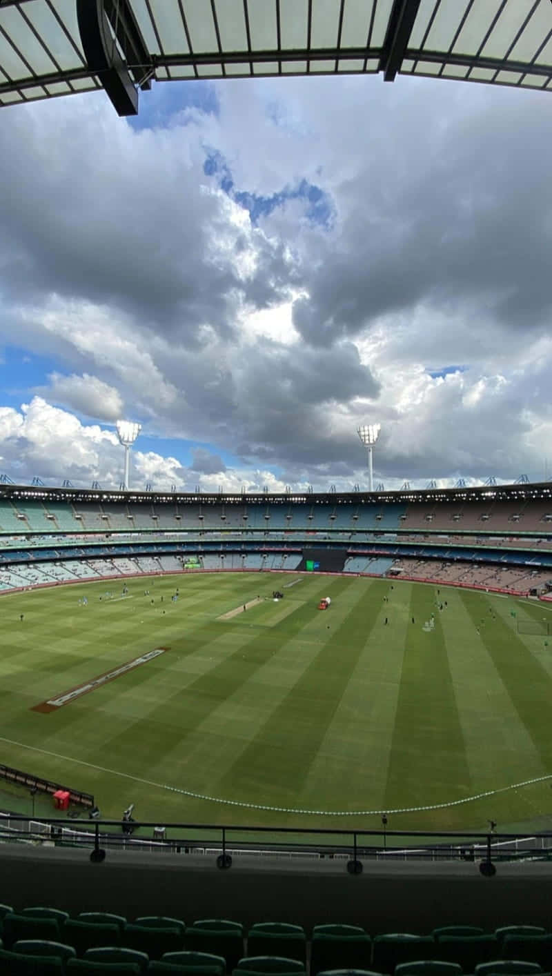 Melbourne Cricket Ground Under Cloudy Skies Wallpaper