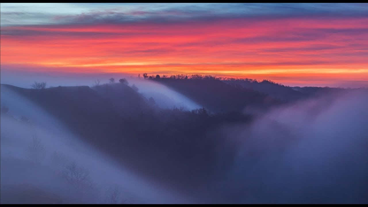 Mellow Sunset Scenery Above The Mountains Wallpaper