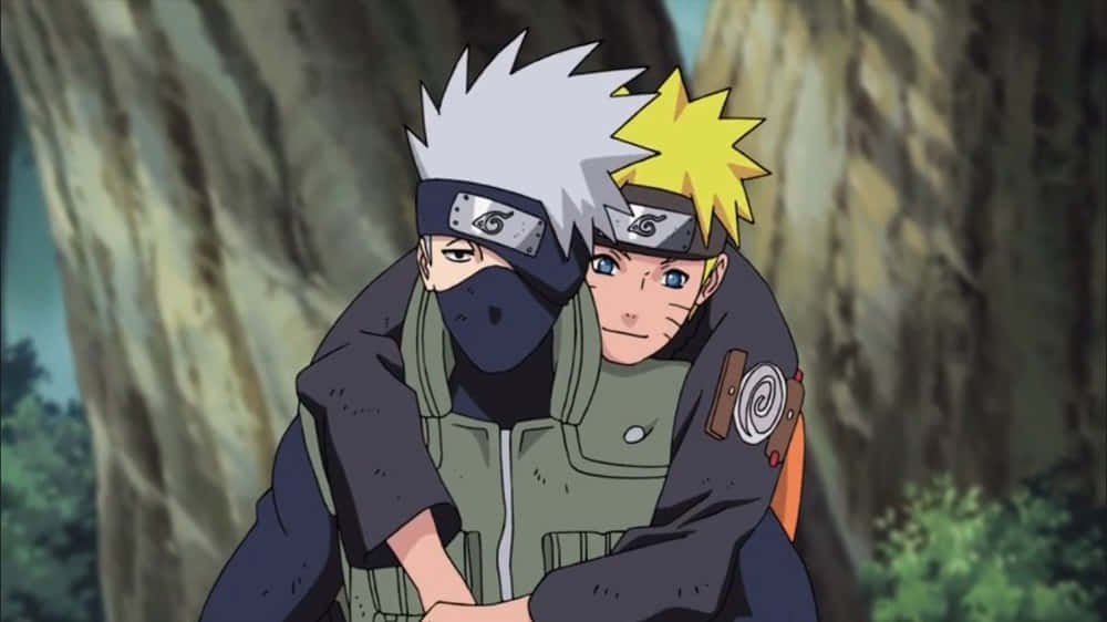 Mentor And Student: Kakashi And Naruto In Action Wallpaper