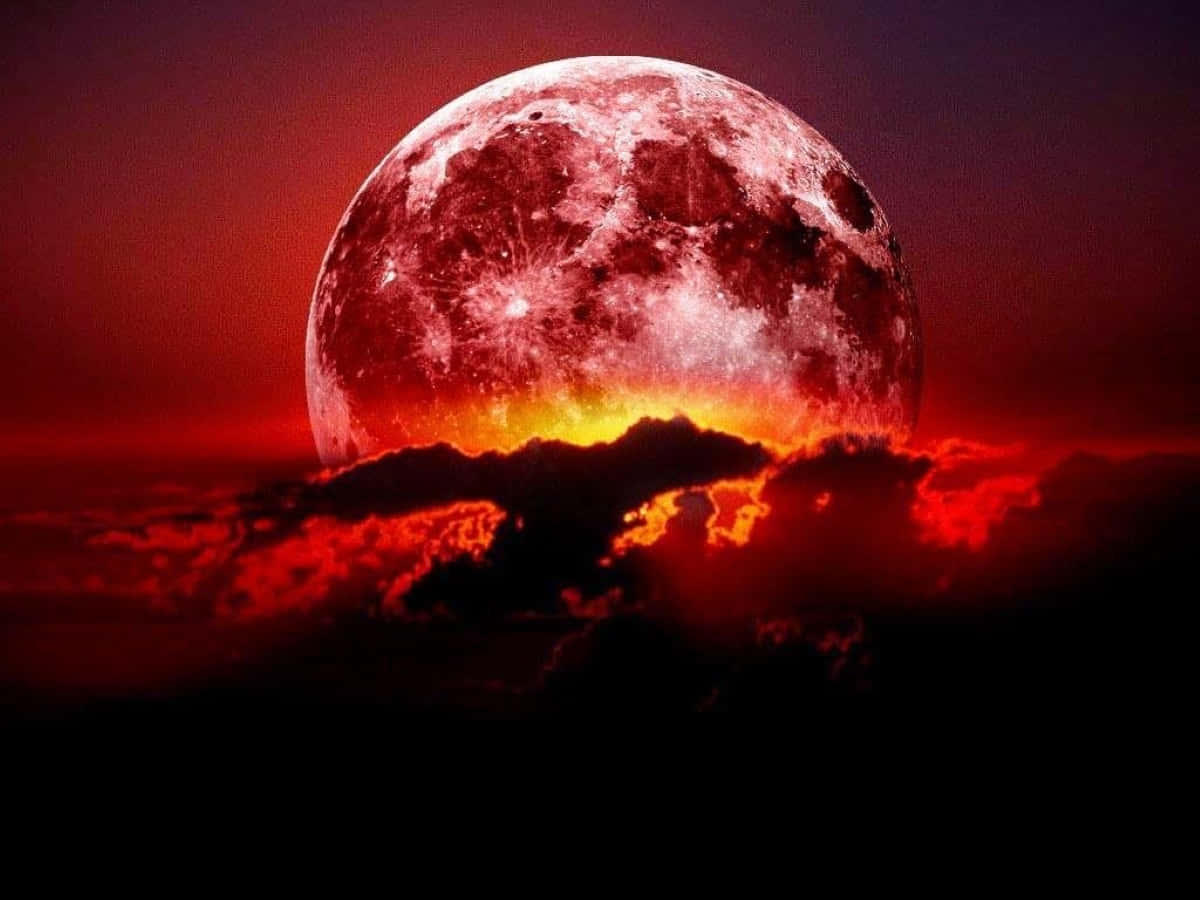 Mesmerizing Strawberry Moon Illuminating The Night Sky Wallpaper