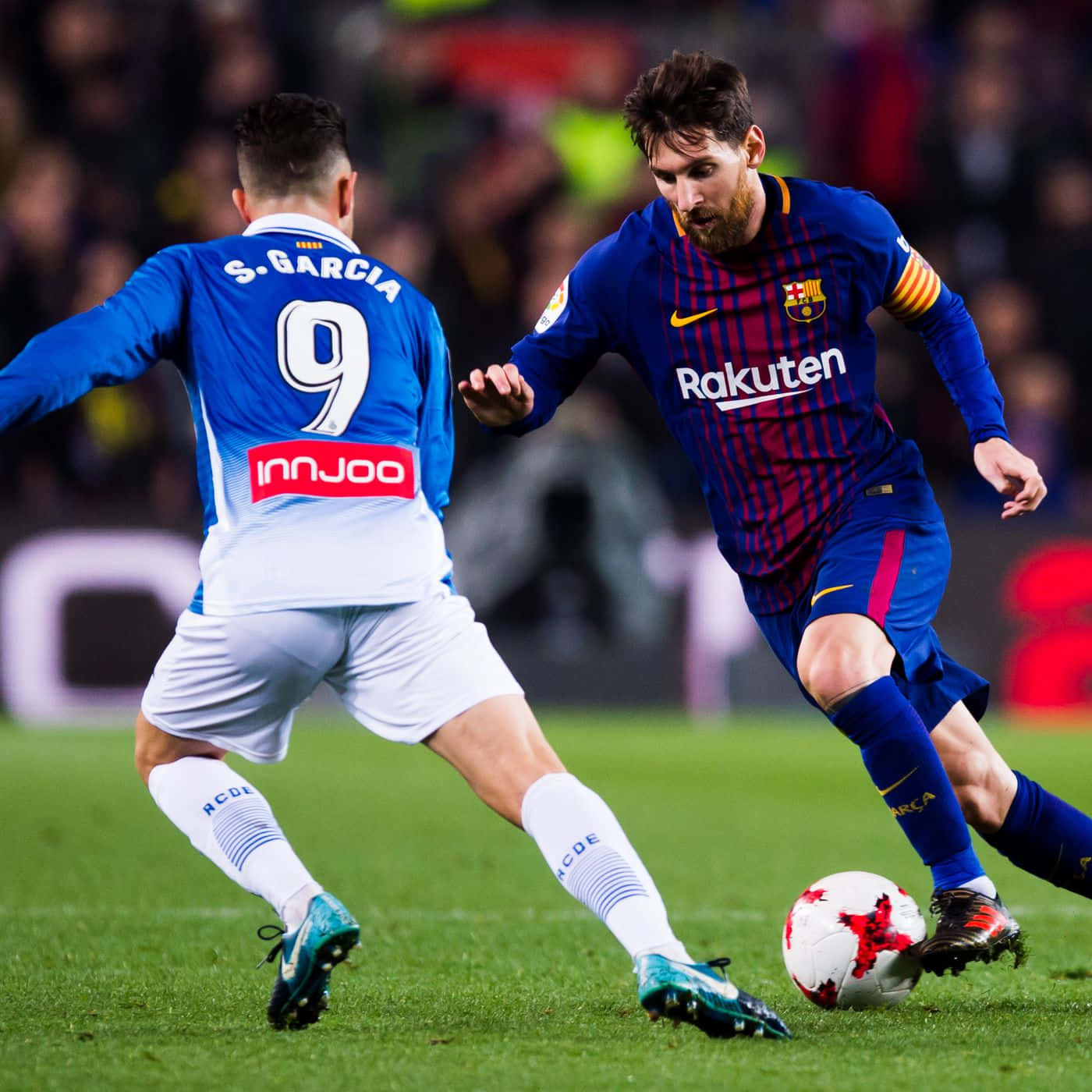 Messi In Action Dribbling Past Defender Wallpaper