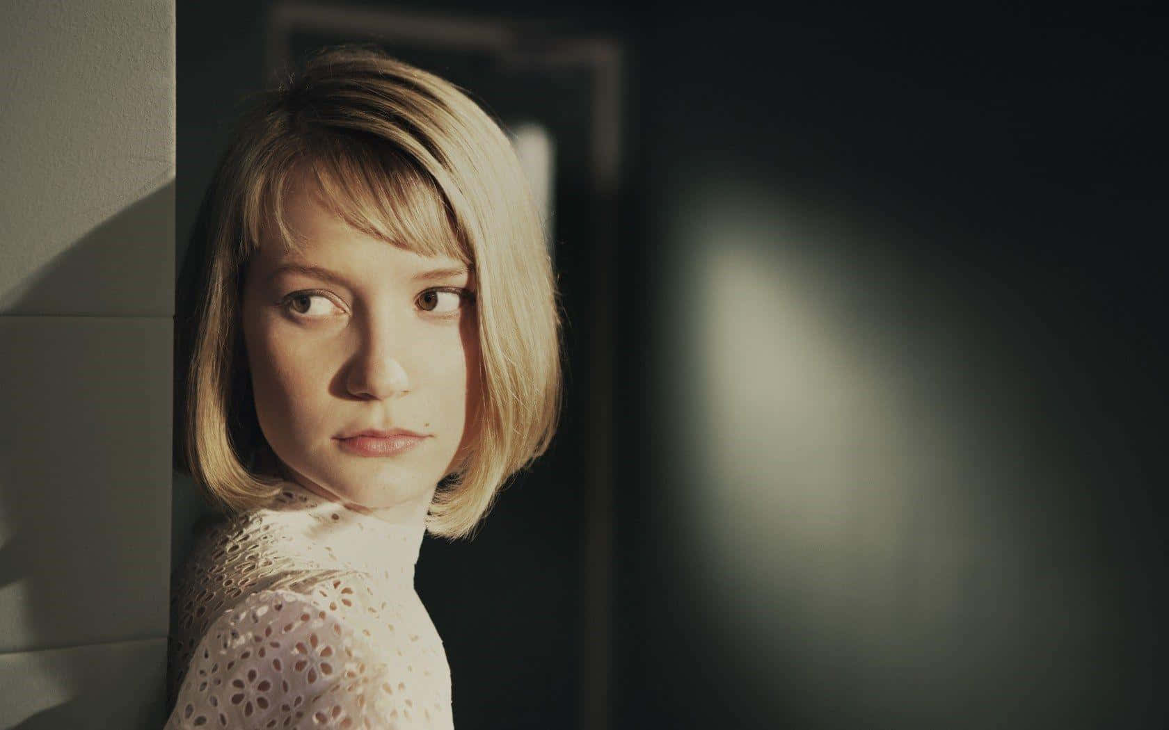 Mia Wasikowska Striking A Pose On A Professional Photoshoot Wallpaper