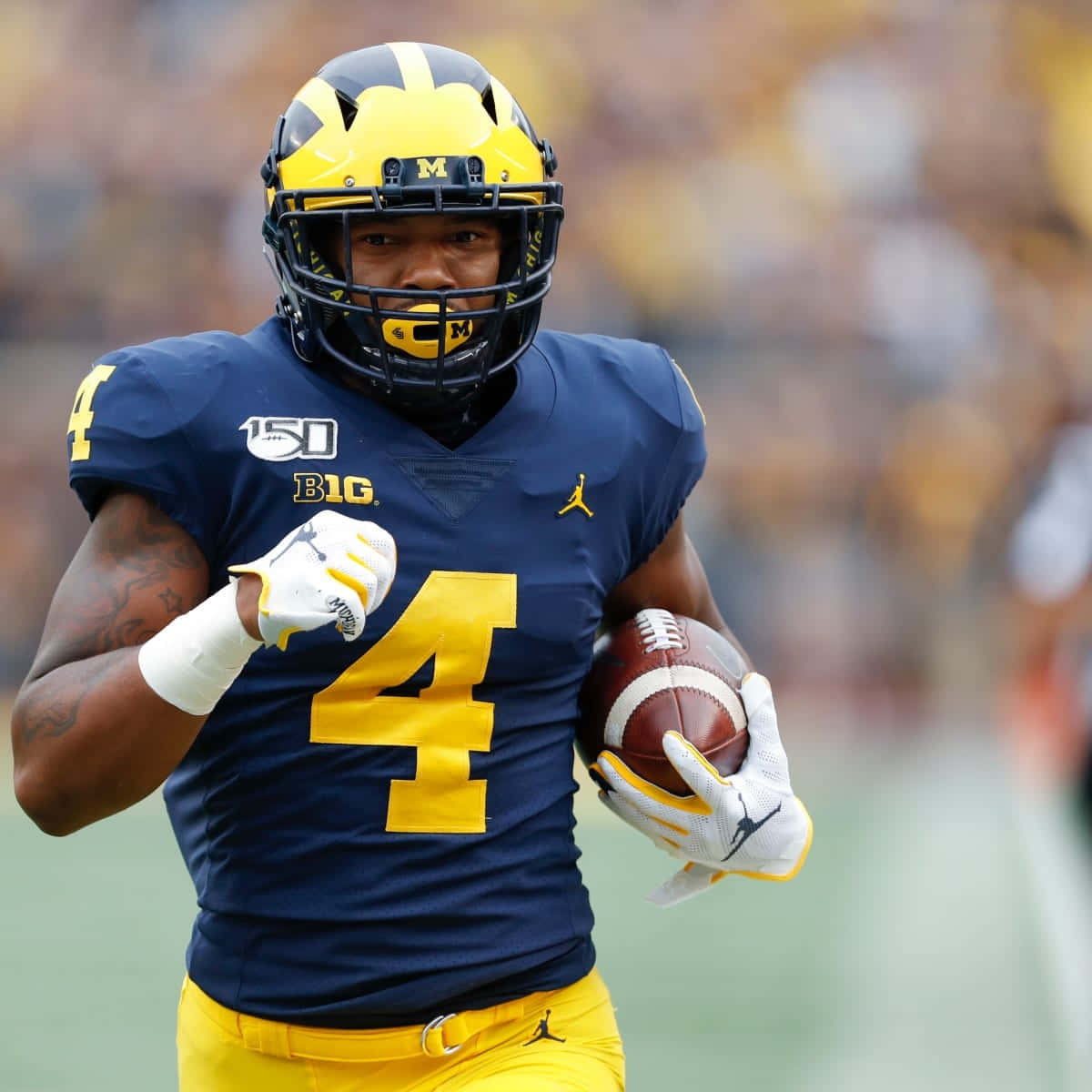 Michigan Football Player Nico Collins Action Shot Wallpaper