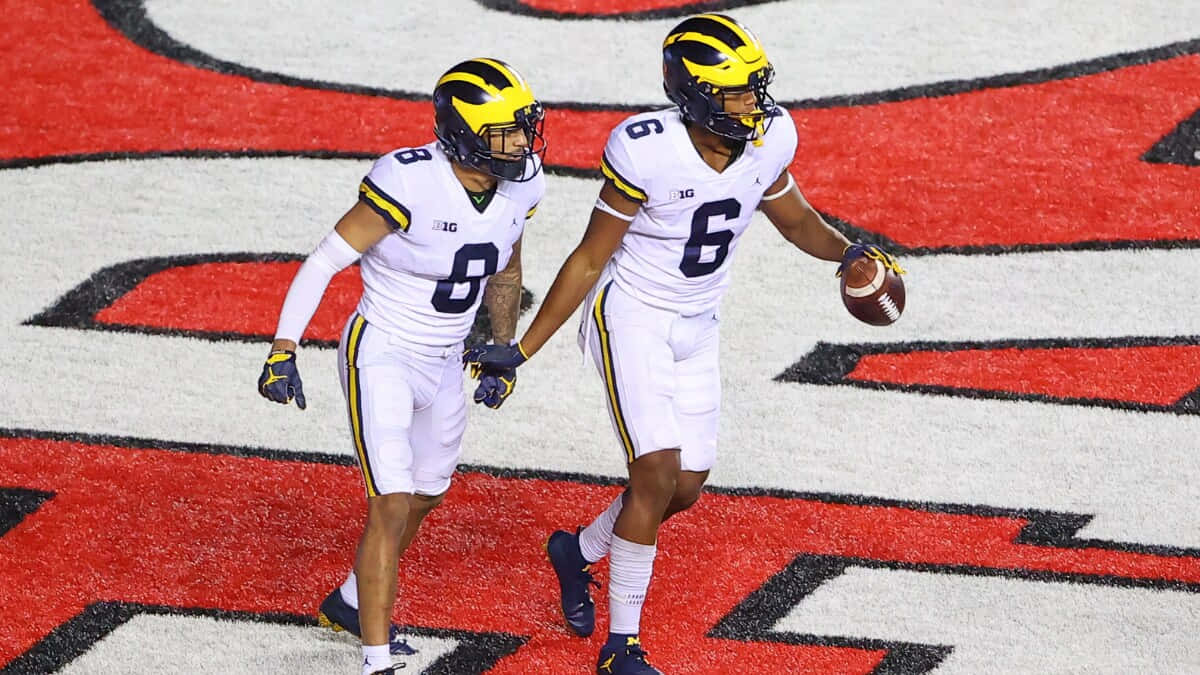 Michigan Football Players Celebrating Wallpaper