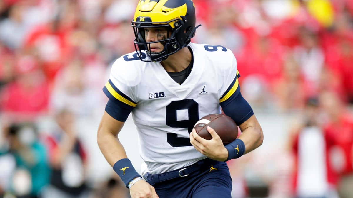 Michigan Quarterback Action Shot Wallpaper