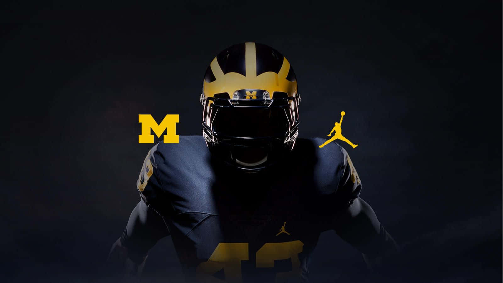 Michigan Wolverines Football Team In Action Wallpaper