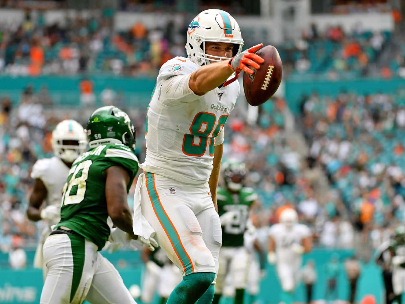 Mike Gesicki Catching Football During Game Wallpaper