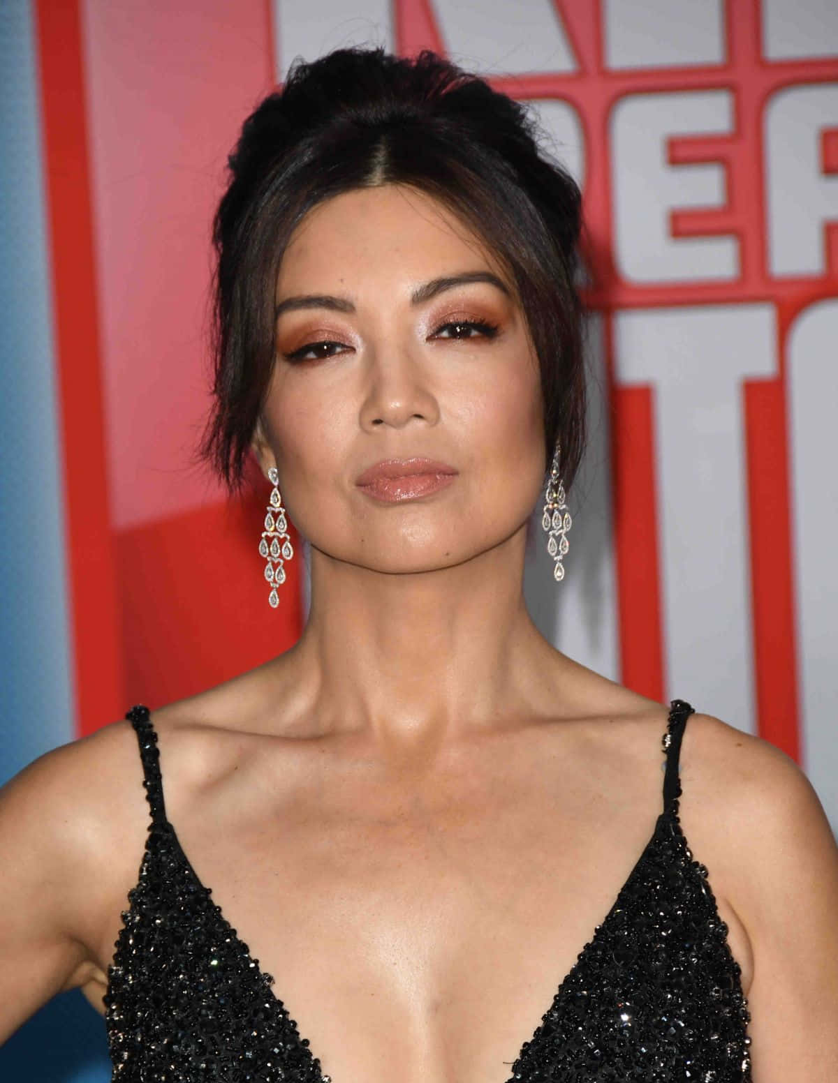 Ming-na Wen Posing Elegantly In A Stunning Outfit Wallpaper