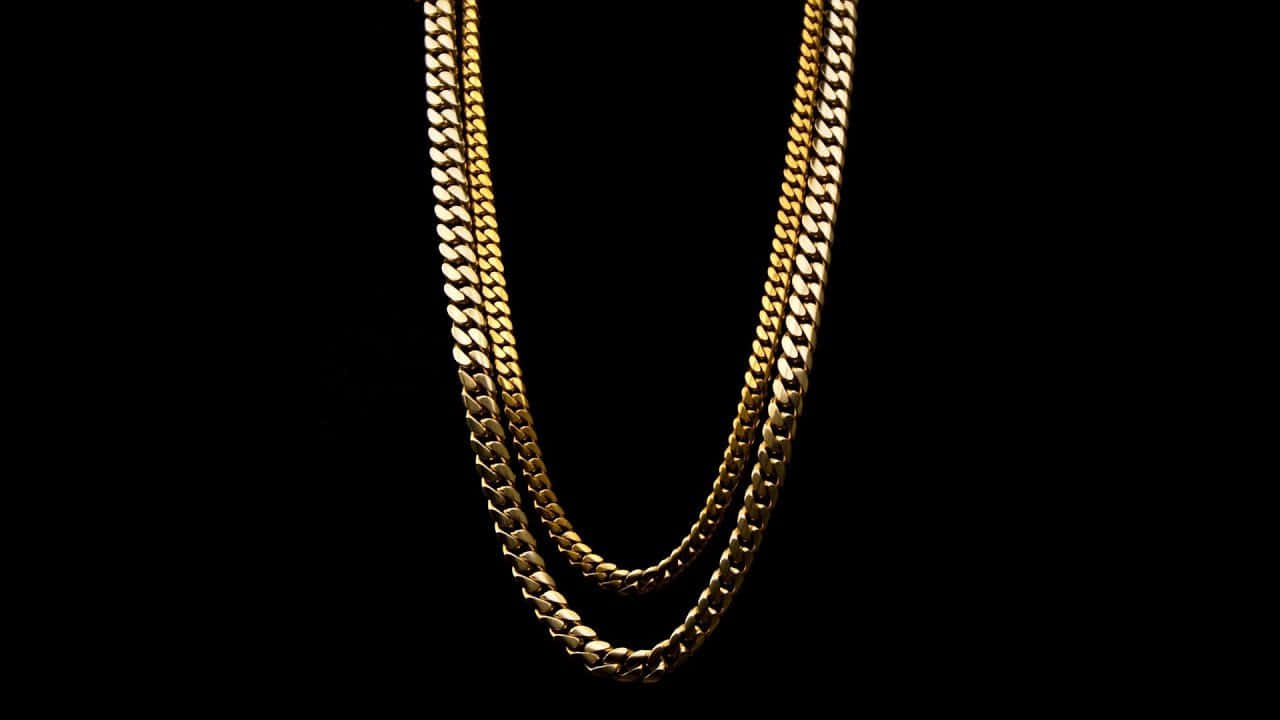 Minimalist And Stylish: A 14kt Gold Chain Wallpaper