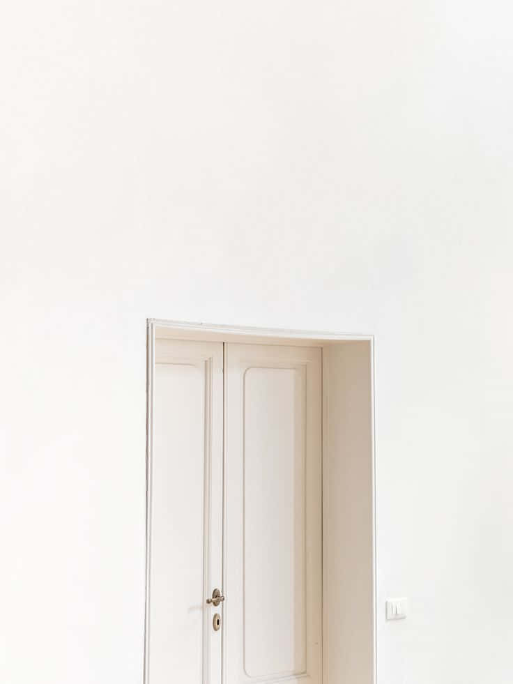 Minimalist Door Design On A Textured Wall Wallpaper