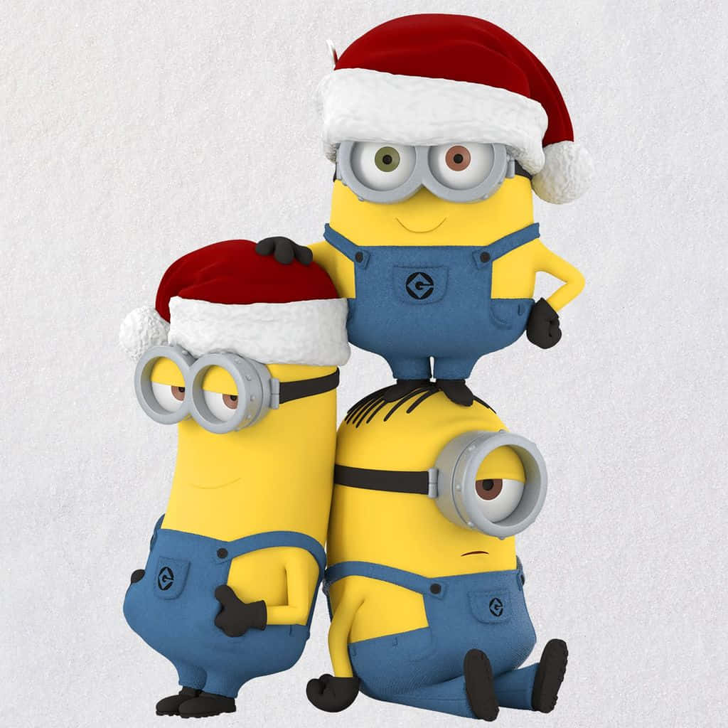 Minionsin Santa Hats Celebrating Christmas Wallpaper