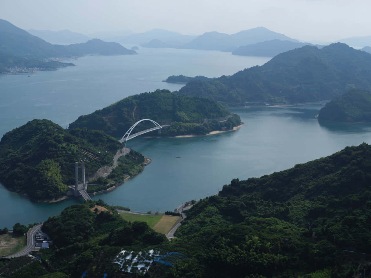 Misty Archipelago Bridge View Wallpaper