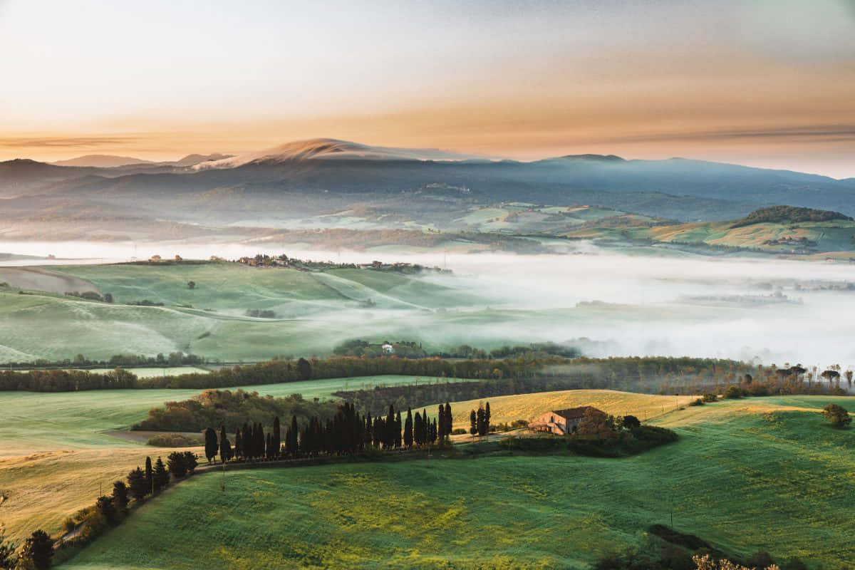 Misty_ Tuscan_ Landscape_at_ Sunrise Wallpaper