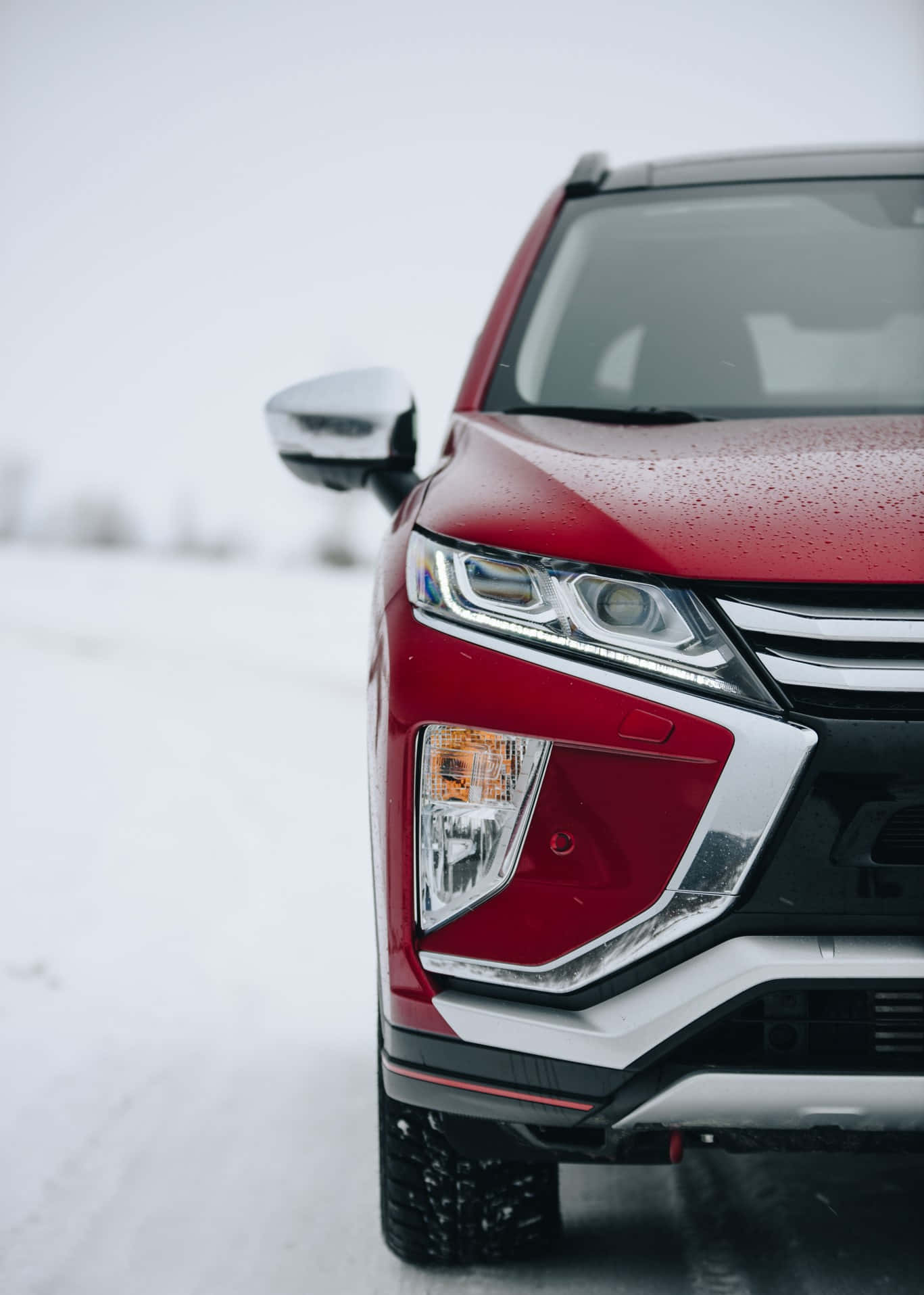 Mitsubishi Eclipse Cross Red Snowy Backdrop Wallpaper