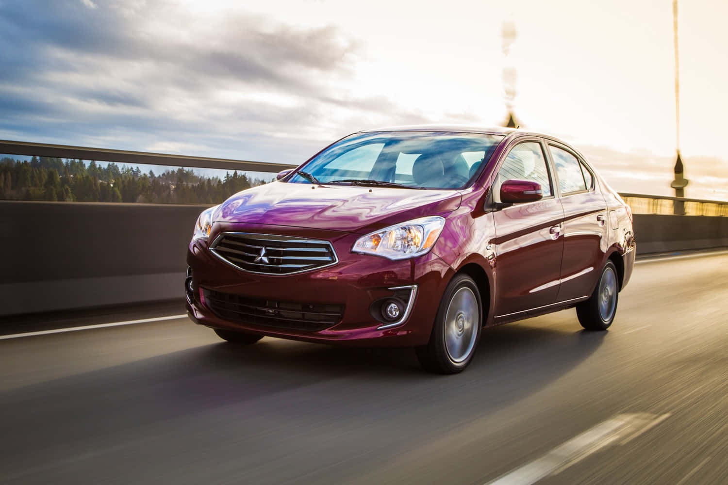 Mitsubishi Mirage Drivingon Bridge Wallpaper