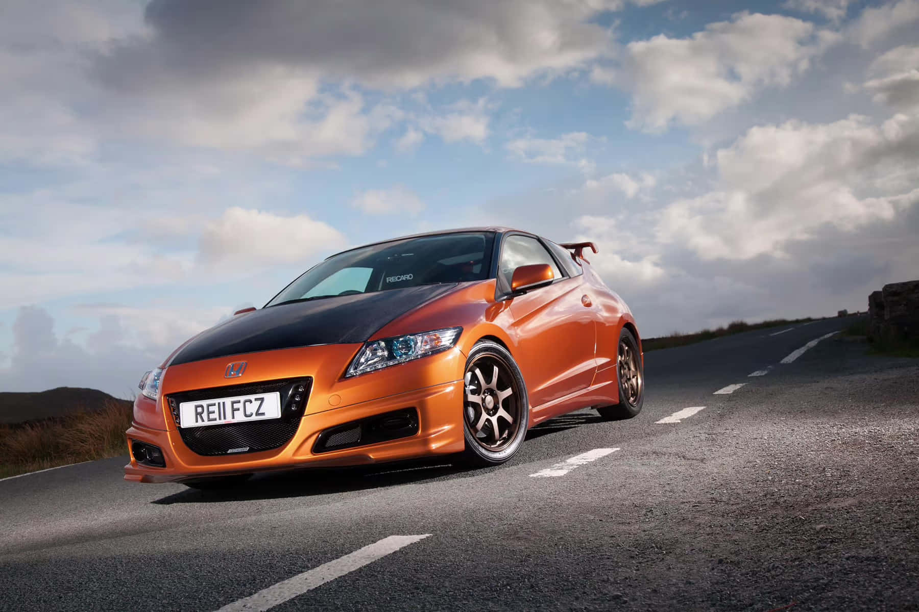 Modern Sleek Honda Cr-z Hybrid On The Road Wallpaper