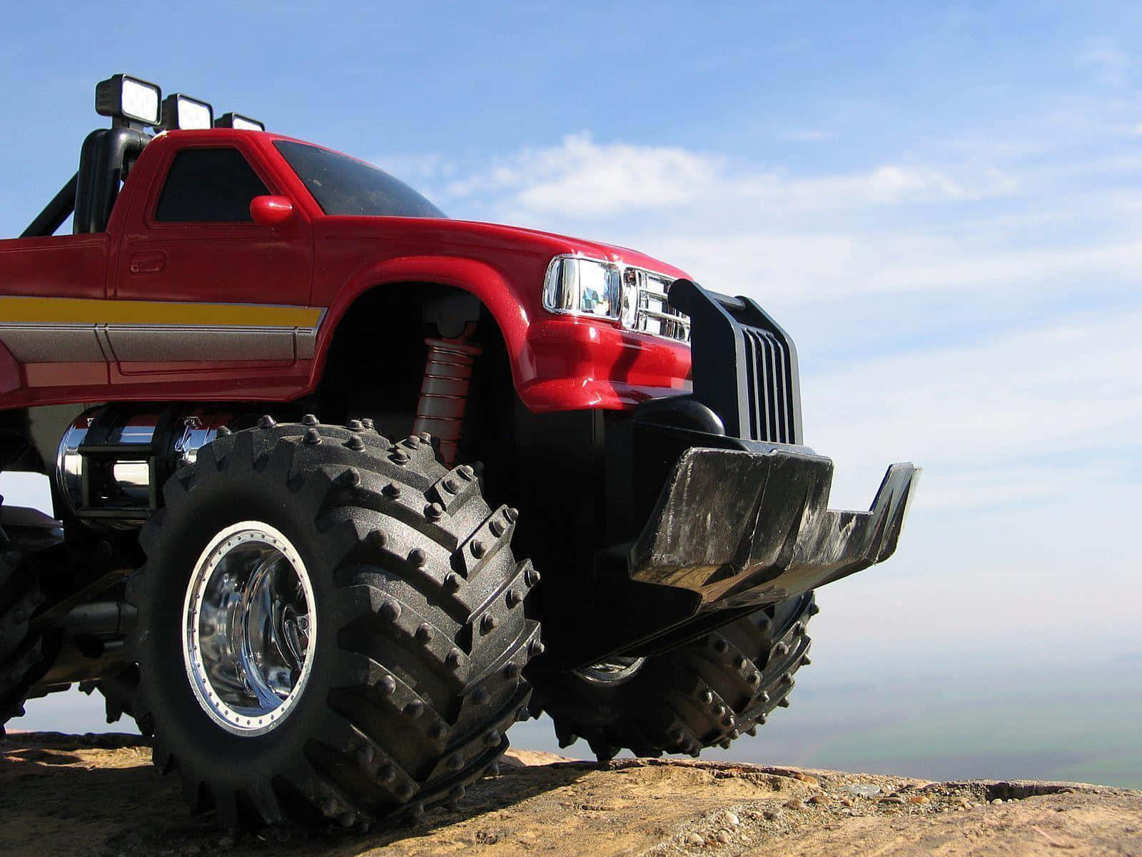 Monster Truck On Edge Of Cliff Wallpaper