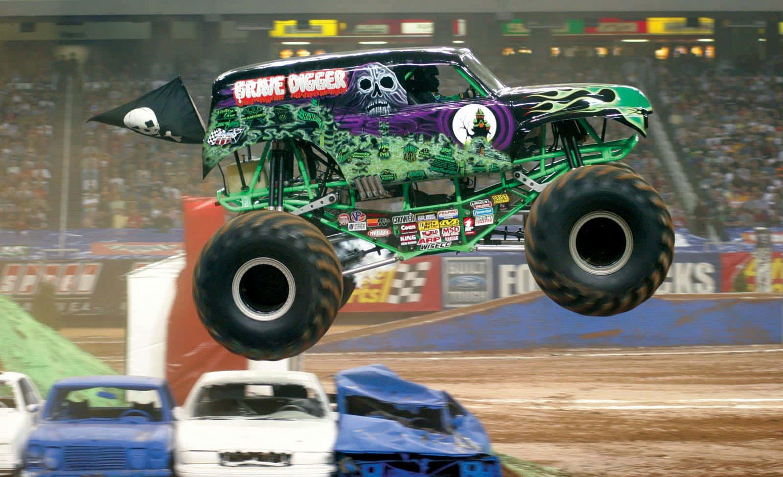 Monster Truck Smashes Blue And White Cars Wallpaper