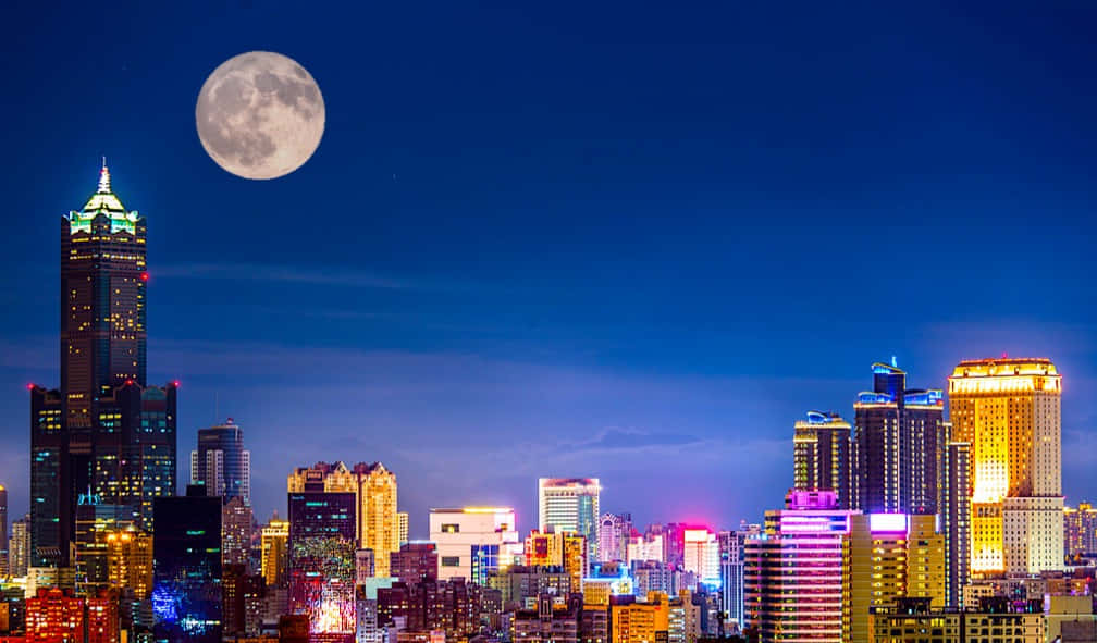 Moonlit_ Urban_ Skyline Wallpaper