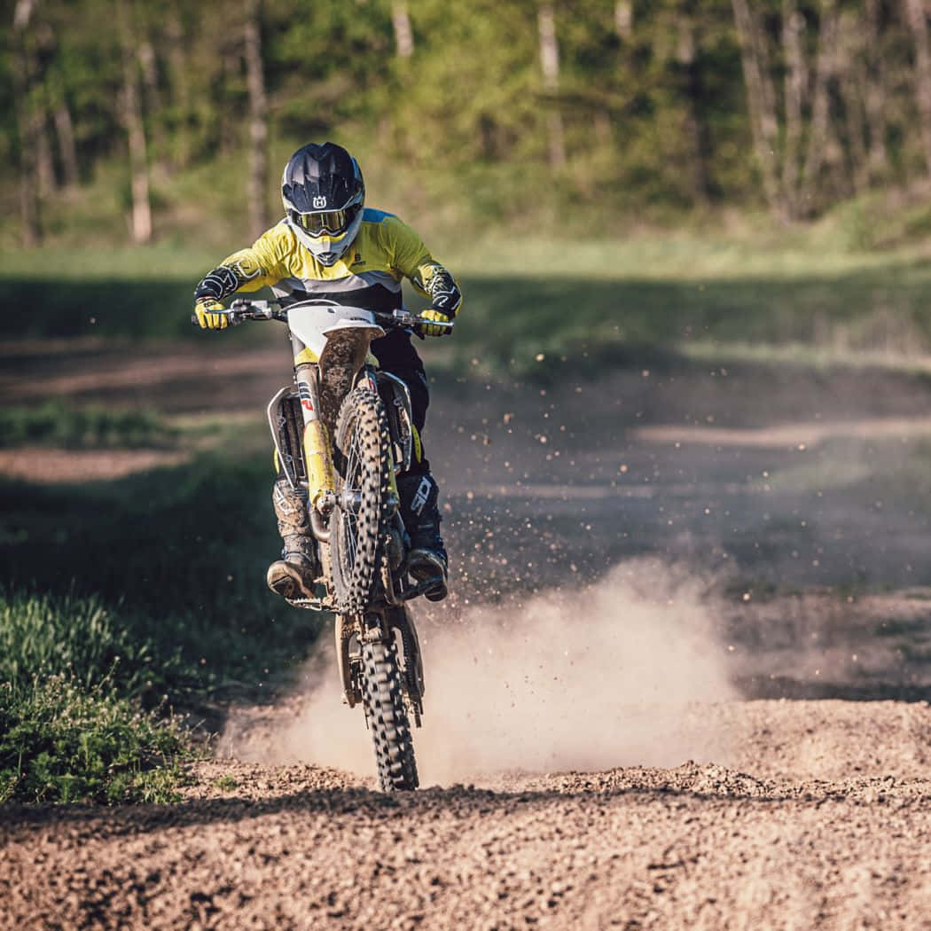 Motocross Riderin Action Husqvarna Wallpaper