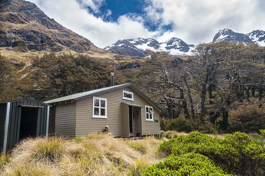 Mountain Hut Snowy Peaks New Zealand Wallpaper