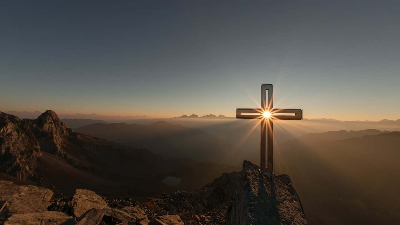 Mountain Summit Crossat Sunrise Wallpaper