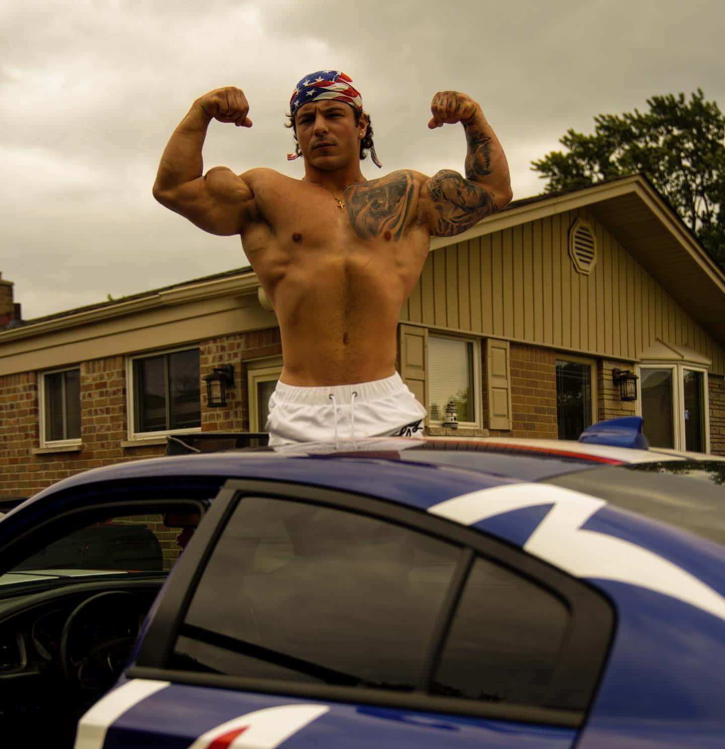 Muscular Man Flexingon Car Wallpaper