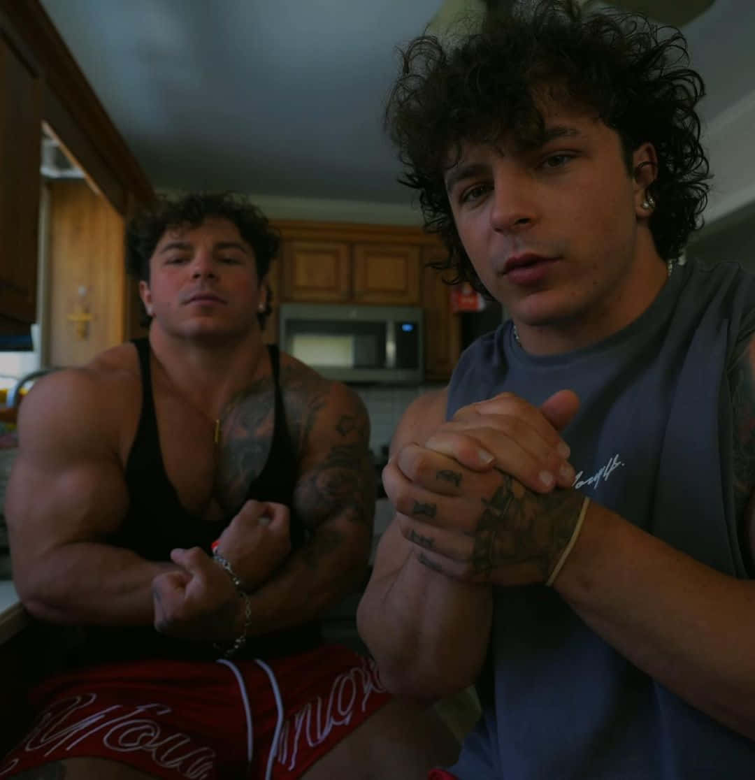 Muscular_ Twins_ Posing_ In_ Kitchen Wallpaper