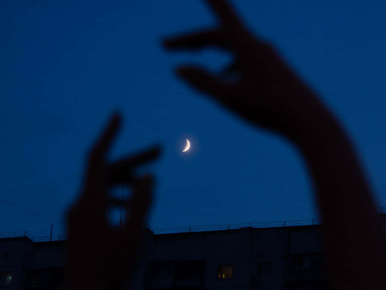 Mysterious Dark Hand Amidst Eerie Atmosphere Wallpaper