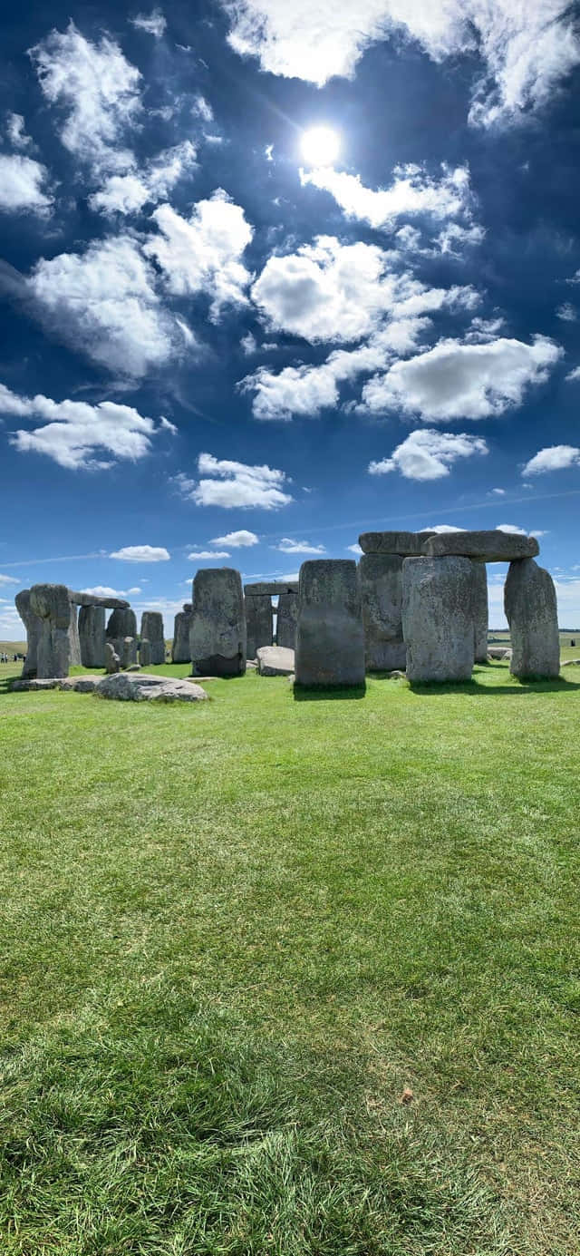 Mystical Stonehenge Amidst The Verdant Plains Wallpaper