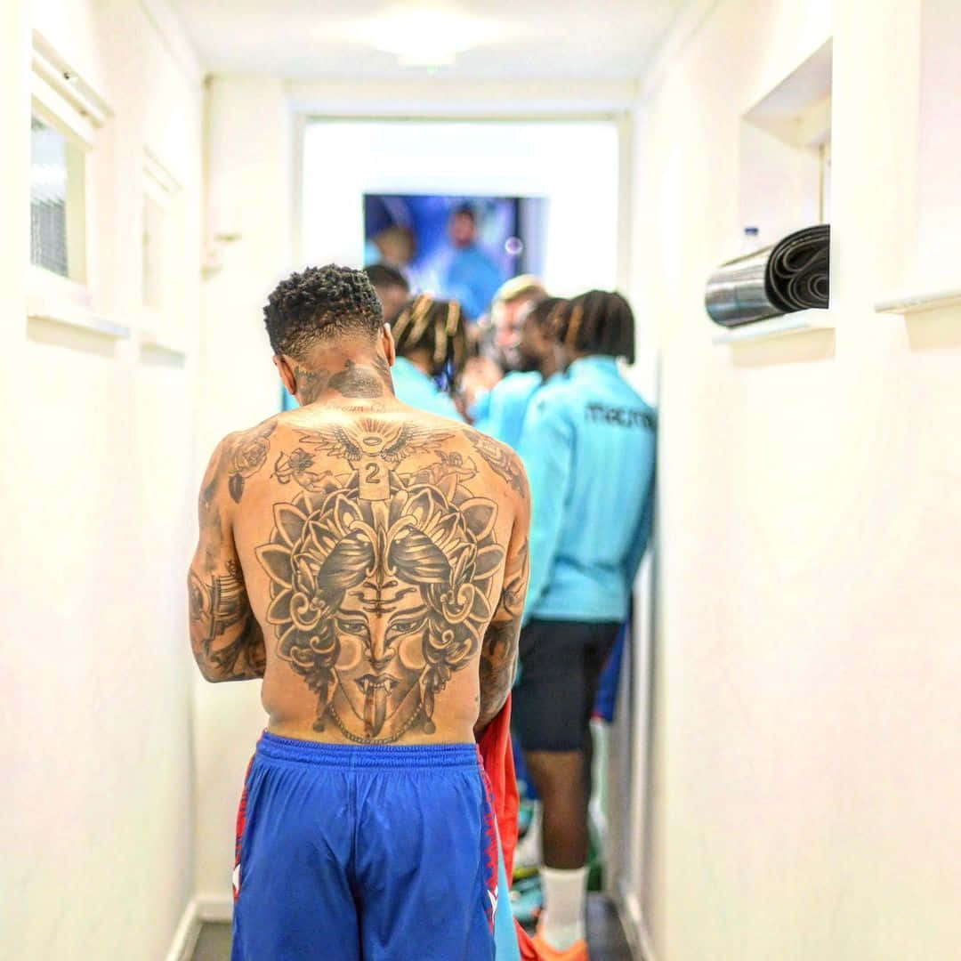 Nathaniel Clyne Showcasing His Back Tattoos Wallpaper