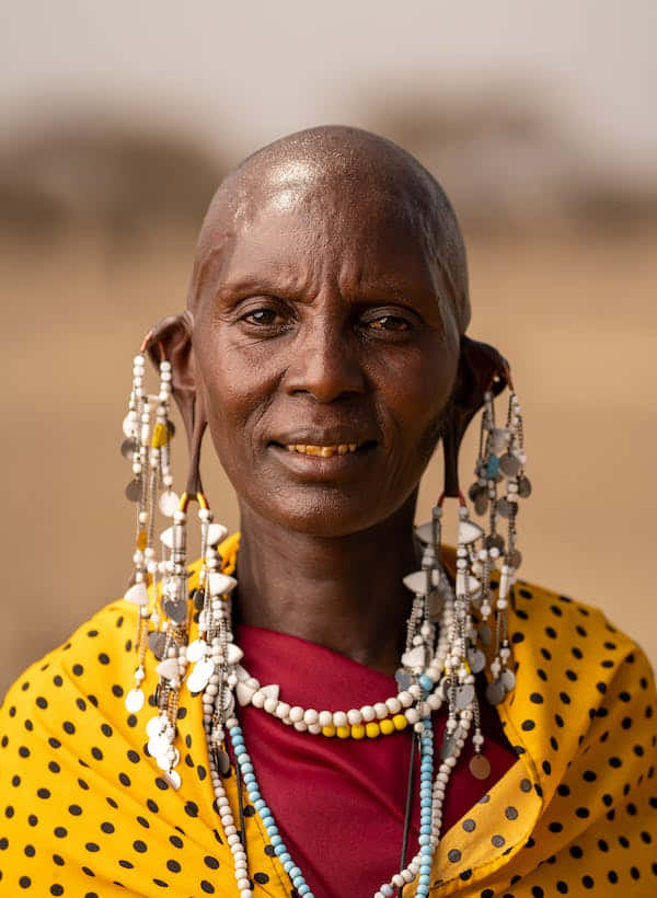 Native Woman Dressed In Traditional Attire Wallpaper