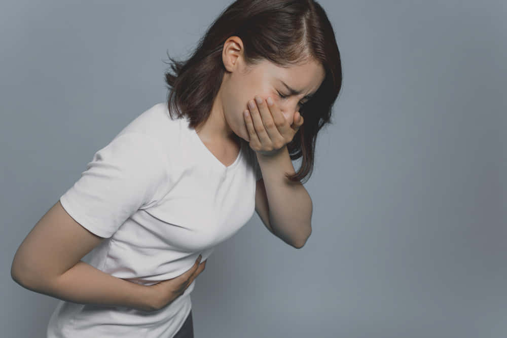 Nauseous Woman In White Shirt Wallpaper