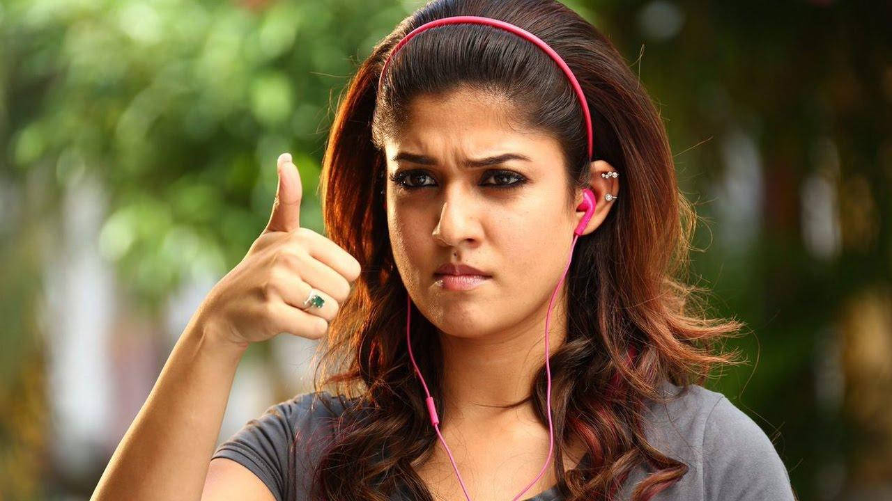 Nayanthara Thumbs Up Pink Headphones Wallpaper