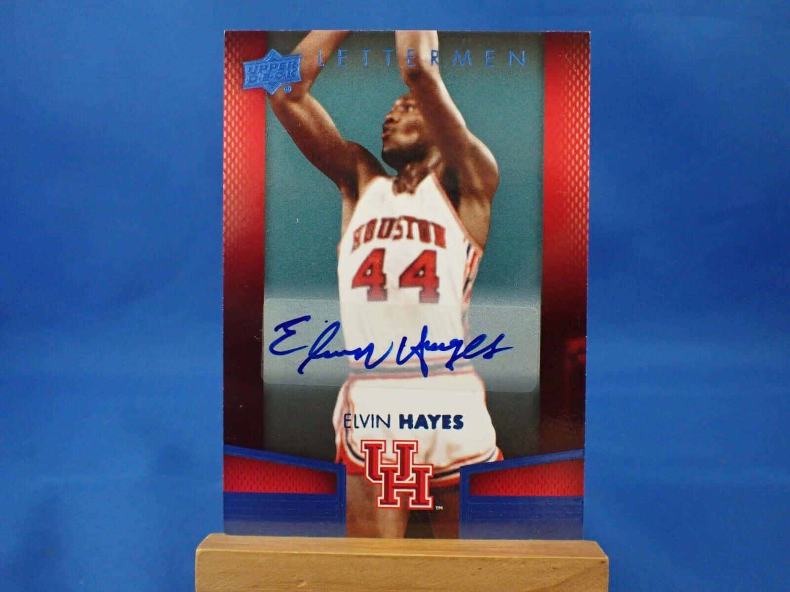 Nba Legend Elvin Hayes Against A Signature Blue Background Wallpaper